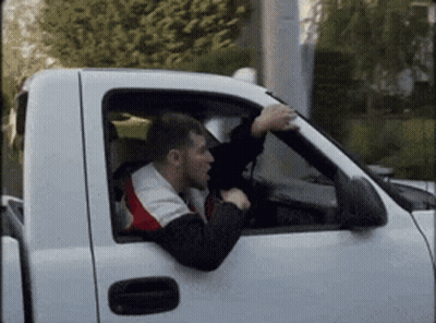 Man Driving White Truck With Hand Out Window GIF