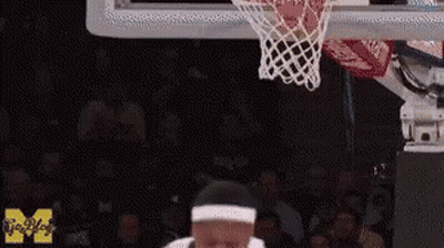 Man Dunking Basketball In Front Of Crowd GIF