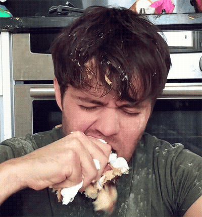 Man Eating Cake With Icing On Face GIF