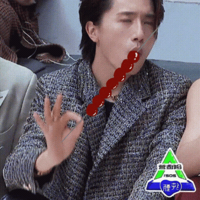 Man Eating Candy Bar With Stick On Couch GIF