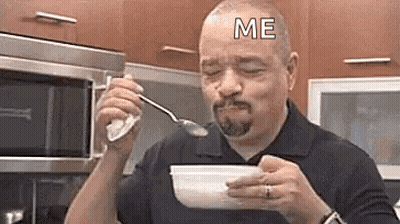 Man Eating Cereal From Bowl With Spoon GIF