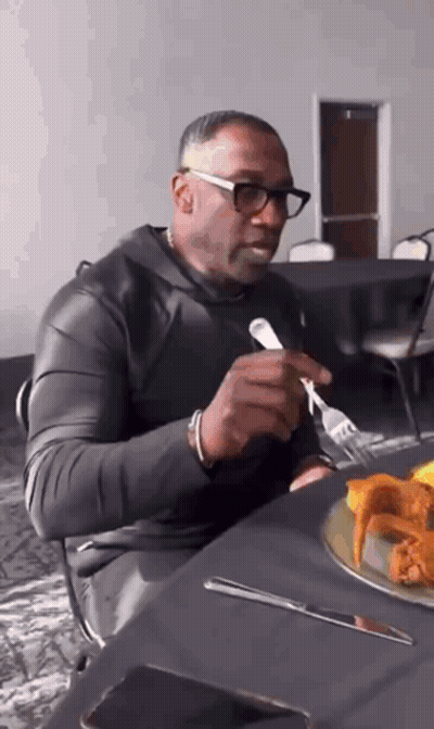 Man Eating Chicken Wings With Fork And Knife GIF