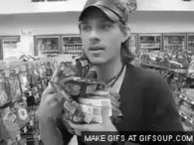 Man Eating Chips In Store GIF