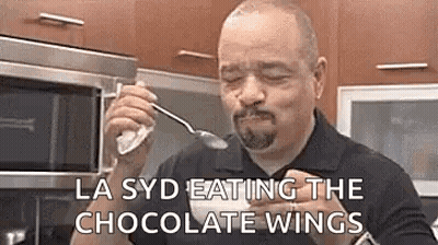Man Eating Chocolate Wings With Spoon GIF