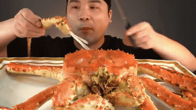 Man Eating Crab With Fork And Knife GIF