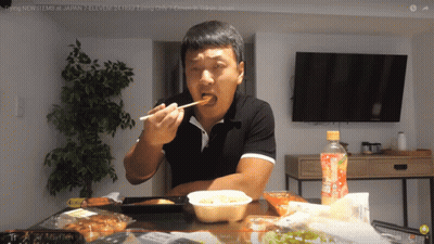 Man Eating Food At Table With Orange Juice GIF
