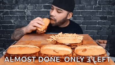 Man Eating Hamburger And French Fries GIF