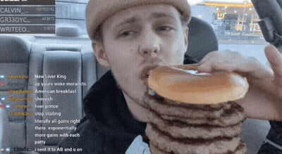 Man Eating Hamburgers In Car Watching Stream GIF