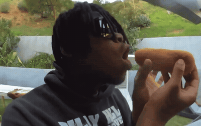 Man Eating Hot Dog In Dirty Harry Hoodie GIF