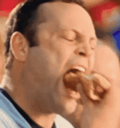 Man Eating Hot Dog With Eyes Closed GIF