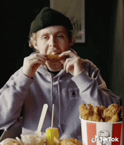 Man Eating KFC Fried Chicken From Bucket GIF