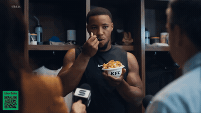 Man Eating KFC While Interviewed By Reporter GIF
