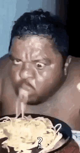 Man Eating Noodles From Plate GIF