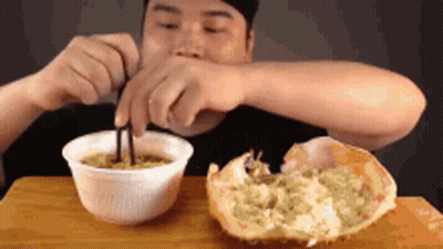 Man Eating Noodles With Crab GIF