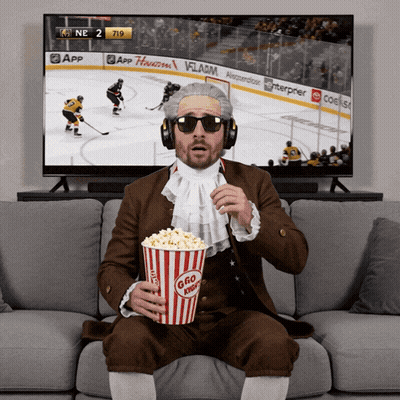 Man Eating Popcorn And Watching Hockey GIF
