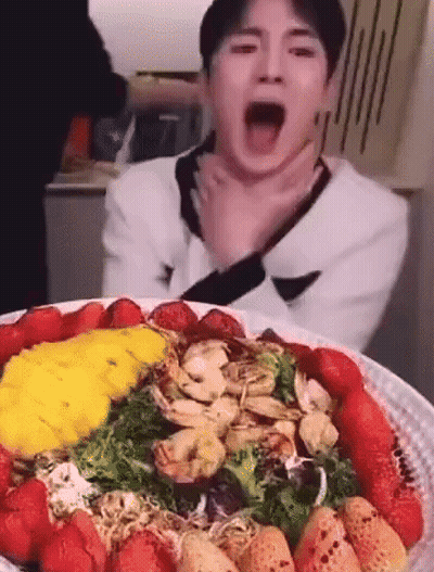 Man Eating Salad With Strawberries And Shrimp GIF