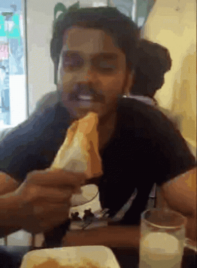 Man Eating Sandwich With Glass Of Milk GIF