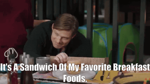 Man Eating Sandwich With It's A Sandwich Of My Favorite Breakfast Foods GIF