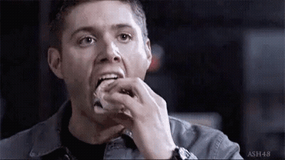 Man Eating Sandwich With Watch