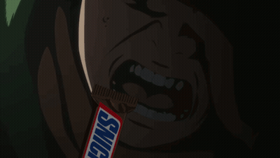 Man Eating Snickers Bar In Dark Room GIF