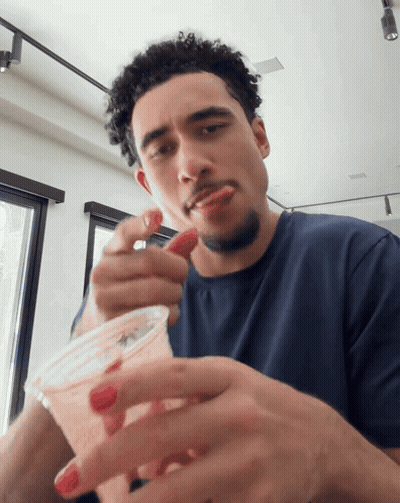 Man Eating Strawberry From Cup GIF