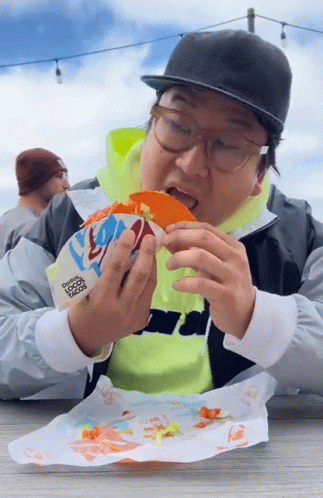 Man Eating Taco From Taco Bell Bag GIF