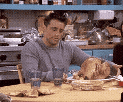 Man Eating Turkey At Table GIF