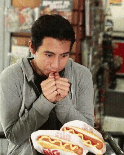 Man Eating Two Hot Dogs With Mustard Big Boy GIF