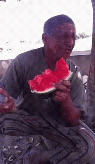 Man Eating Watermelon Under Tree