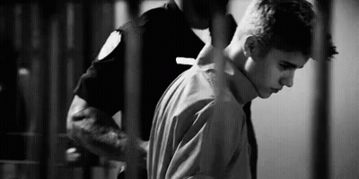 Man Escorted By Police Officer Black And White GIF