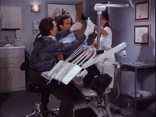 Man Examined By Dentist And Nurse In Dental Chair GIF