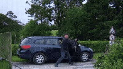 Man Exiting Blue Car With No Turn Sign GIF