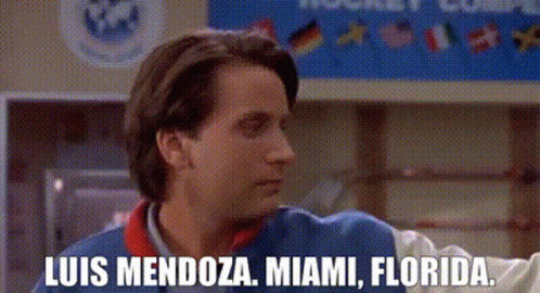 Man Facing Luis Mendoza Miami Florida Sign GIF