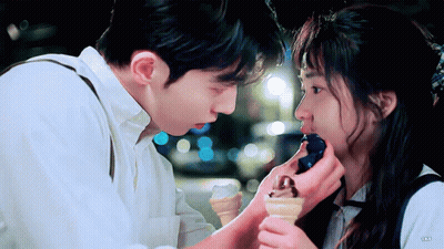 Man Feeding Woman Ice Cream Cone GIF