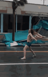 Man Fighting Windy Day GIF