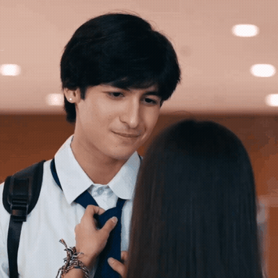 Man Fixing Woman's Tie GIF