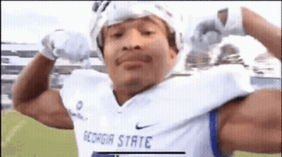 Man Flexing In Georgia State Football Jersey GIF