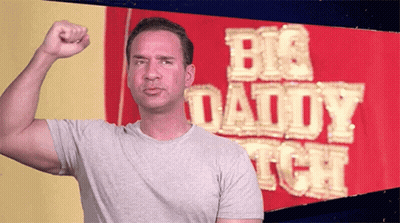 Man Flexing Muscles In Front Of Big Daddy Sign GIF