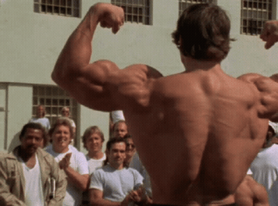 Man Flexing Muscles In Front Of Crowd GIF