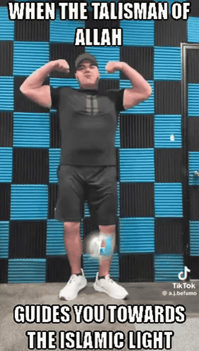 Man Flexing Muscles In Front Of Wall Saying When The Talisman Of Allah Guides You Towards GIF