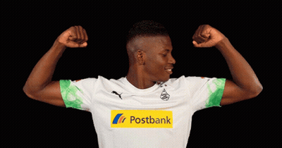 Man Flexing Muscles In Postbank Jersey GIF
