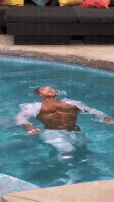 Man Floating On His Back In Pool GIF