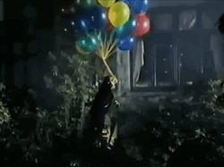 Man Floating With Baloons GIF