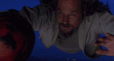 Man Flying Holding Bowling Ball GIF