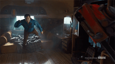Man Flying Holding Chainsaw Ash Vs Evil Dead GIF