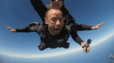 Man Flying In Black Skydive Shirt GIF
