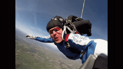 Man Flying In Blue And White Pyrenees Outfit GIF