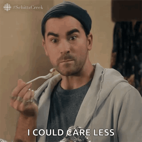 Man From Schitt's Creek Saying I Could Care Less While Eating GIF