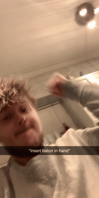 Man Funny Face Insert Baton In Hand GIF
