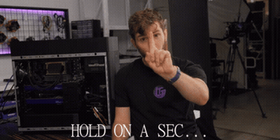 Man Gesturing Saying Hold On a Sec